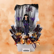 Halloween arrangement with Merlina doll, cookies and chocolates